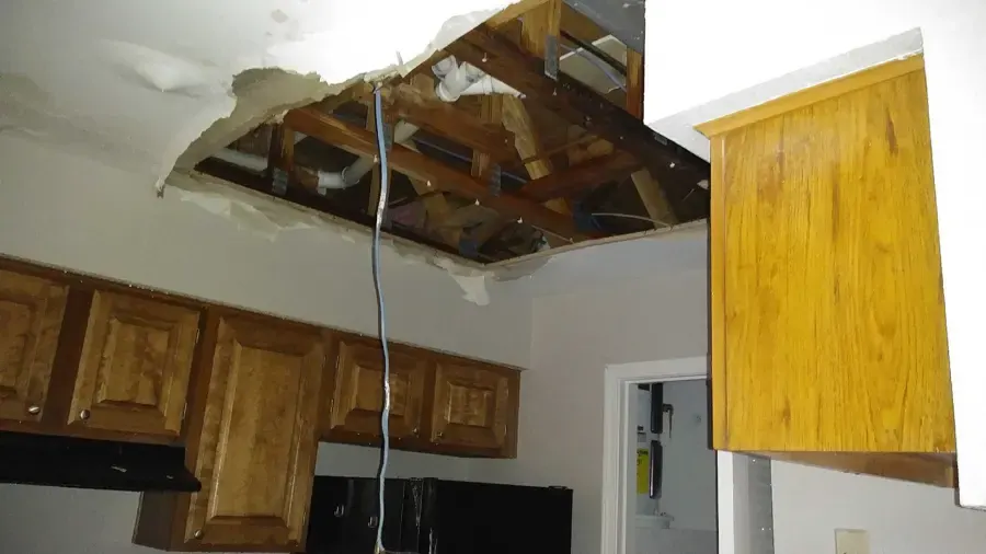 Kitchen ceiling opened after water came through from the floor above